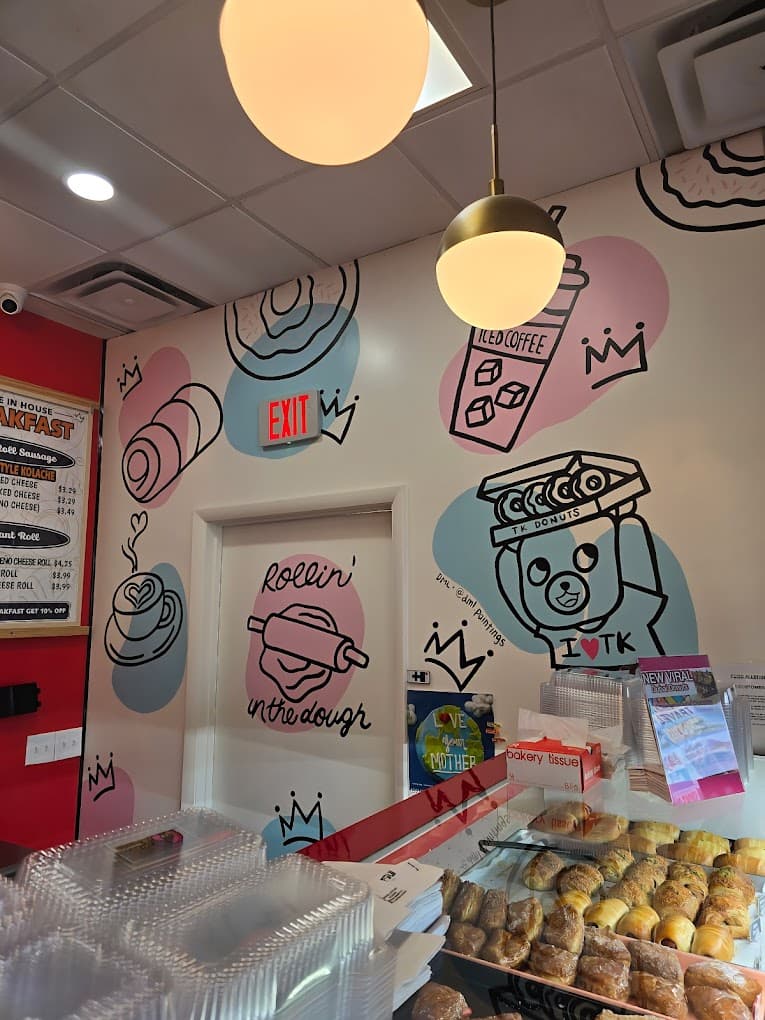 TK Donuts shop mural with bear mascot